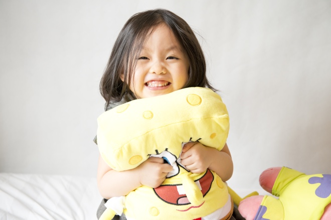 Asian girl holding spongebob